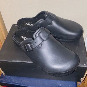 Black lined slip on clogs